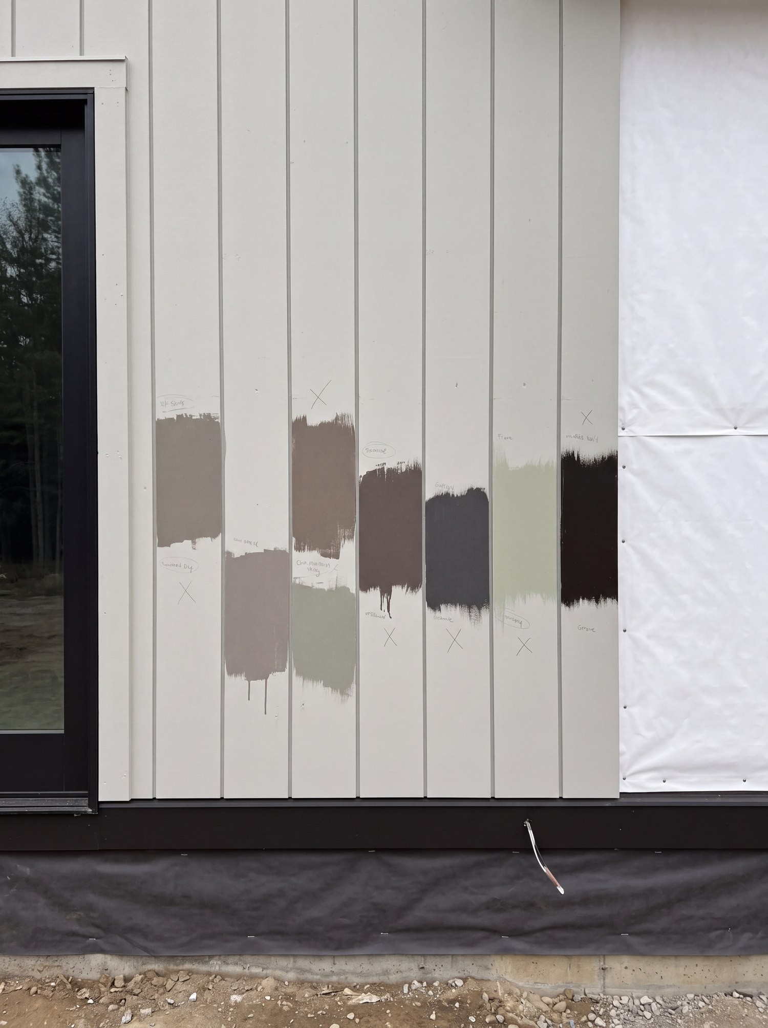 Colors brushed onto siding on site